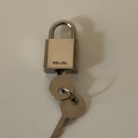 Prada silver Tone Lock n key EUC - Picture 1 of 1